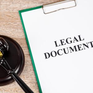 Gavel and legal documents on a desk.