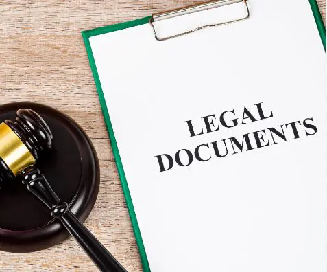 Gavel and legal documents on a desk.