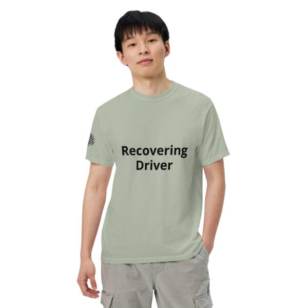 Man wearing a green "recovering driver" shirt.