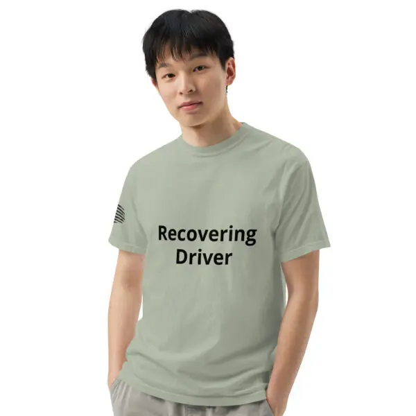 Man wearing a green "recovering driver" t-shirt.