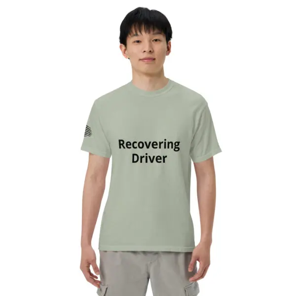 Man wearing a green "recovering driver" t-shirt.