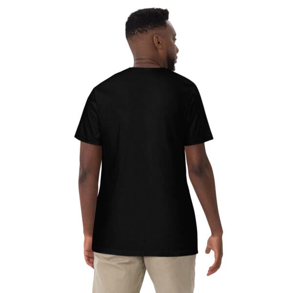 Man wearing a black t-shirt, back view.