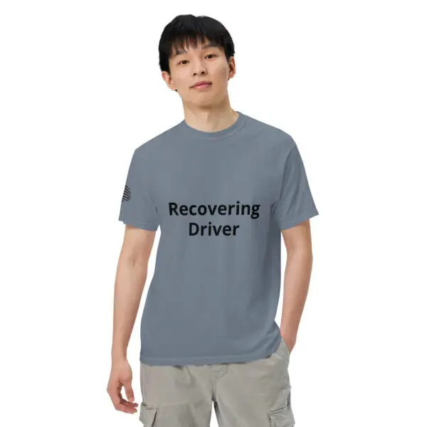 Man wearing a "recovering driver" shirt.