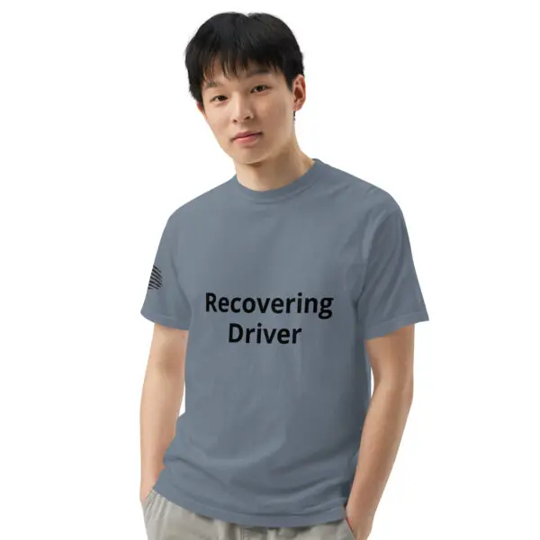 Man wearing a grey "recovering driver" t-shirt.