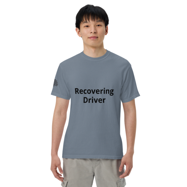 Man wearing a blue "Recovering Driver" t-shirt.