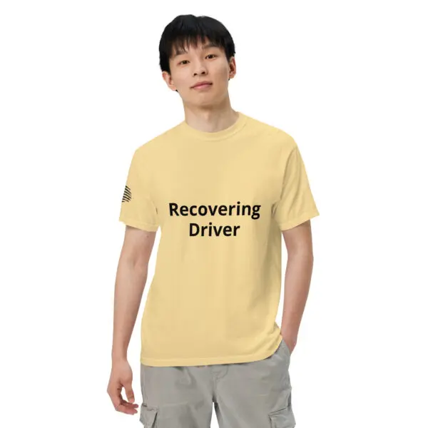 Man wearing a "recovering driver" t-shirt.