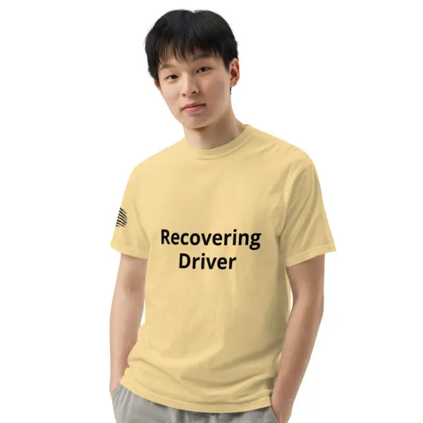 Man wearing a yellow "recovering driver" shirt.