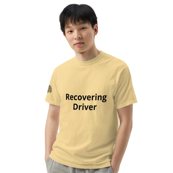 Man wearing a yellow "recovering driver" t-shirt.