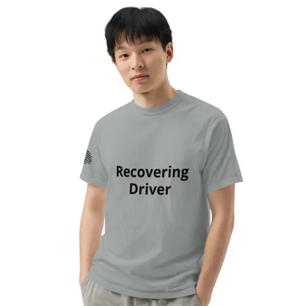 Man wearing a gray t-shirt that says "recovering driver."