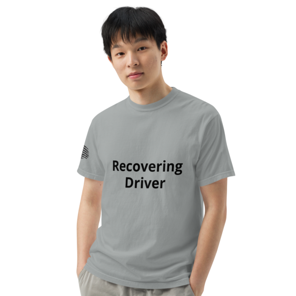 Man wearing a grey "recovering driver" shirt.