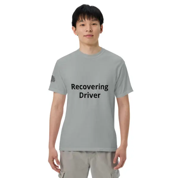 Man wearing a gray "recovering driver" t-shirt.