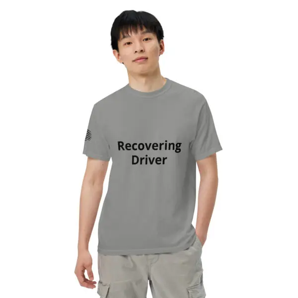 Man wearing a grey t-shirt that says "Recovering Driver"