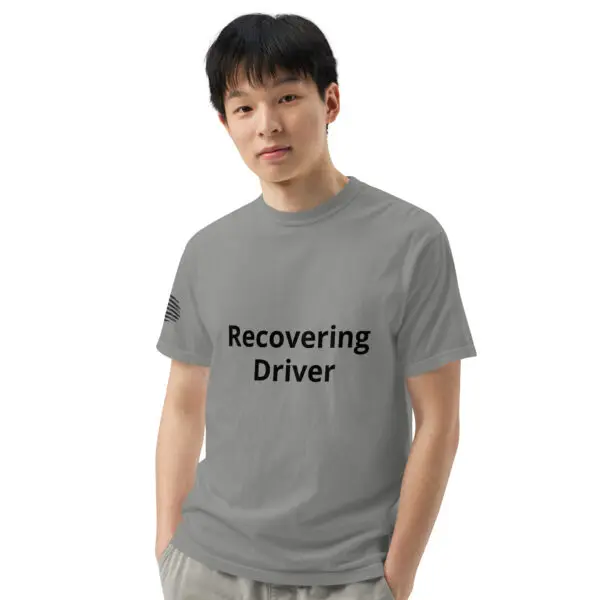 Man wearing a gray "Recovering Driver" T-shirt.