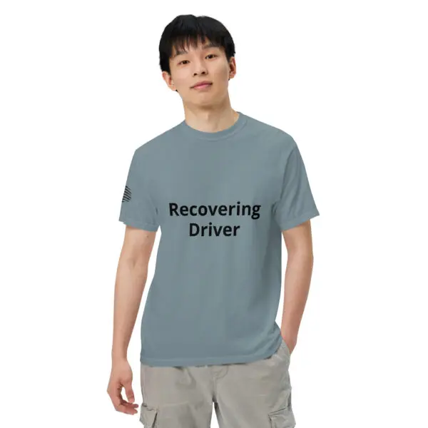 Man wearing a "recovering driver" t-shirt.