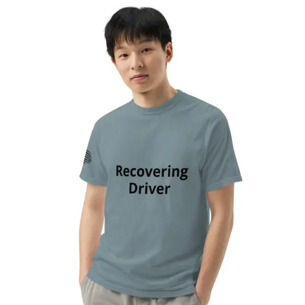 Man wearing a "recovering driver" t-shirt.