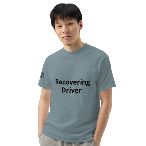 Man wearing a blue "recovering driver" shirt.