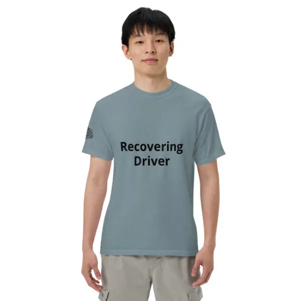 Man wearing a blue "Recovering Driver" t-shirt.