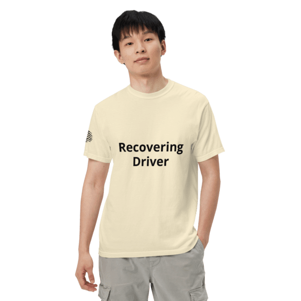 Man wearing a "recovering driver" t-shirt.