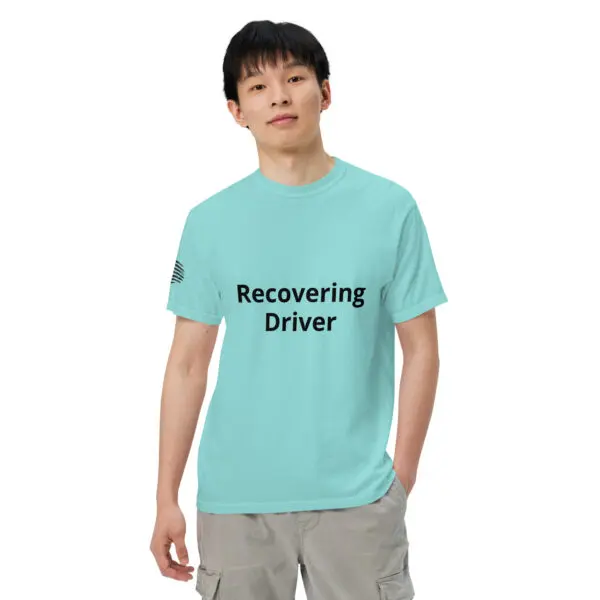 Man wearing a "recovering driver" t-shirt.