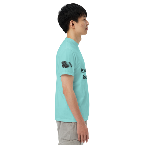 Man wearing light blue t-shirt with American flag.