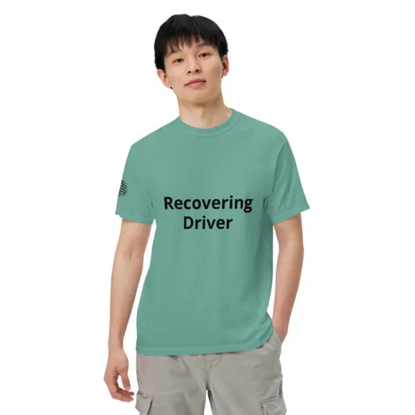 Man wearing a green "recovering driver" t-shirt.