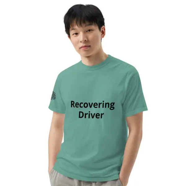 Man wearing a green "recovering driver" shirt.