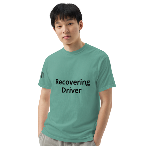 Man wearing a "recovering driver" t-shirt.