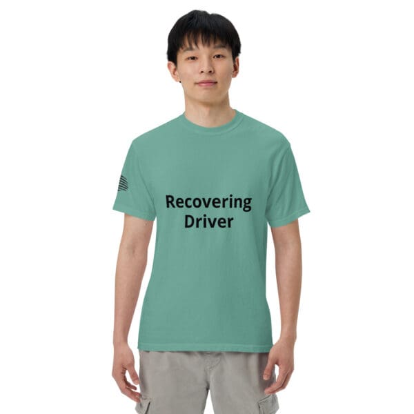 Man wearing a "recovering driver" t-shirt.