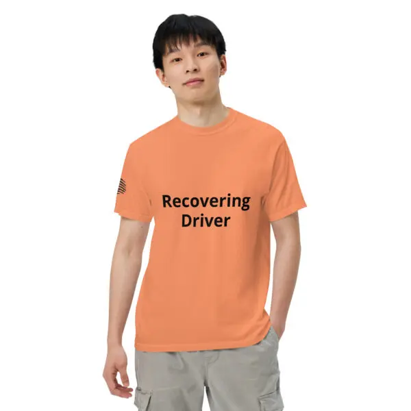 Man wearing an orange t-shirt that says "Recovering Driver"