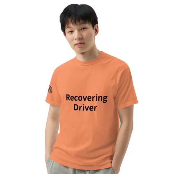 Man wearing an orange "recovering driver" shirt.