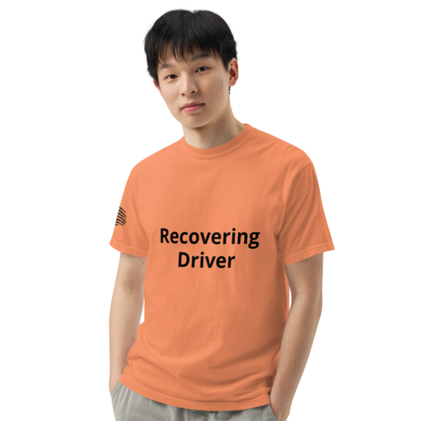 Man wearing an orange shirt that says "Recovering Driver".