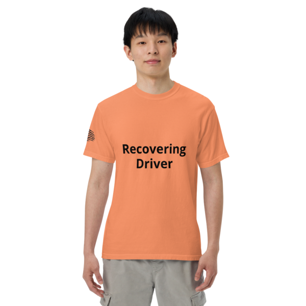 Man wearing an orange t-shirt that says "Recovering Driver"