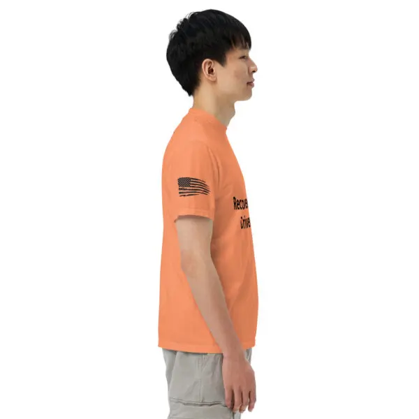 Man wearing an orange t-shirt with an American flag.