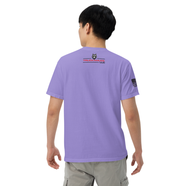 Man wearing a purple t-shirt with logo.