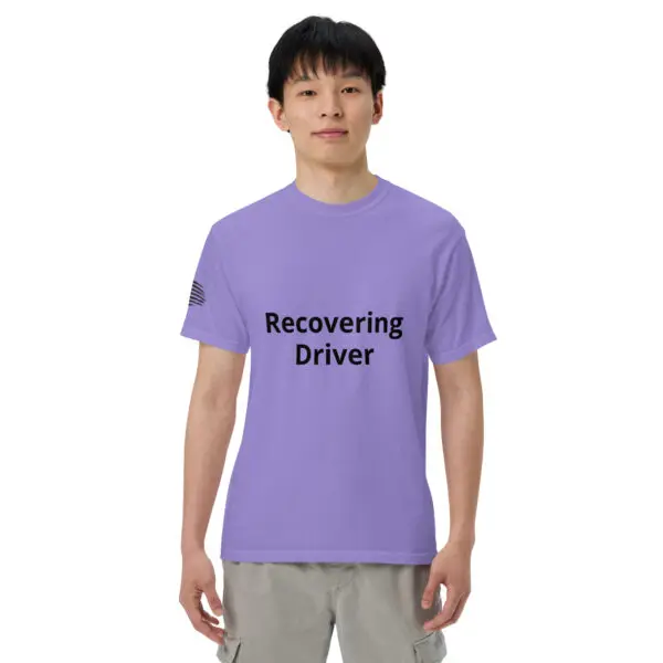 Man wearing a purple "Recovering Driver" t-shirt.