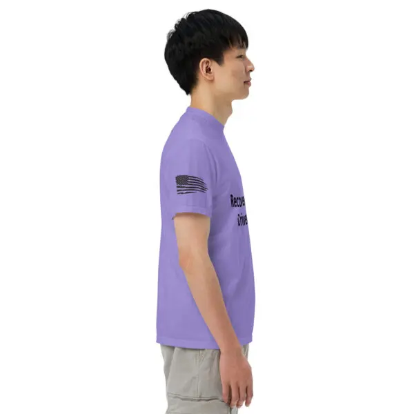 Man wearing a purple t-shirt with an American flag.