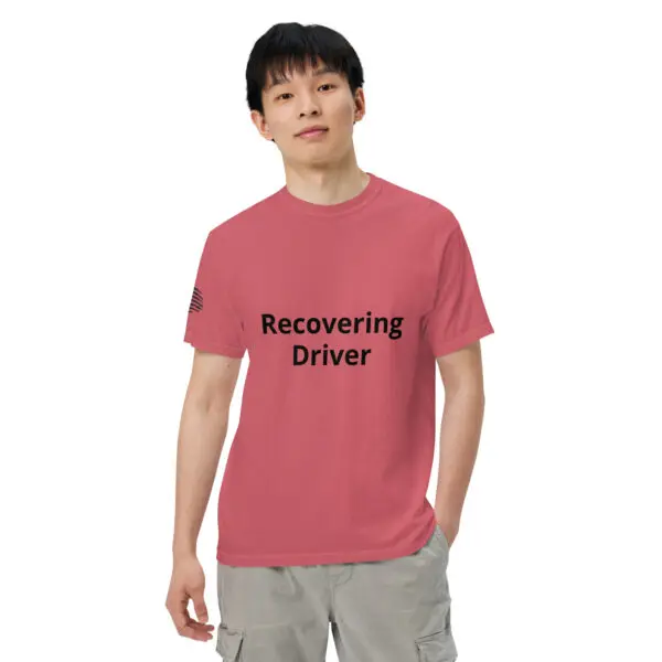 Man wearing a pink "recovering driver" shirt.