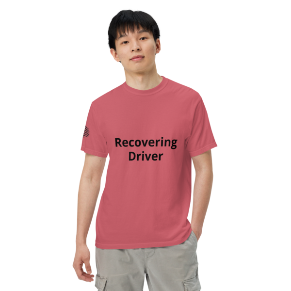 Man wearing a pink "recovering driver" t-shirt.