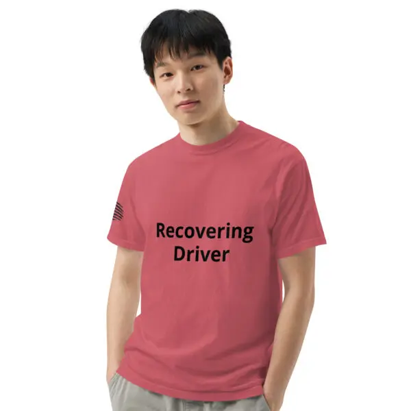 Man wearing a pink "recovering driver" shirt.