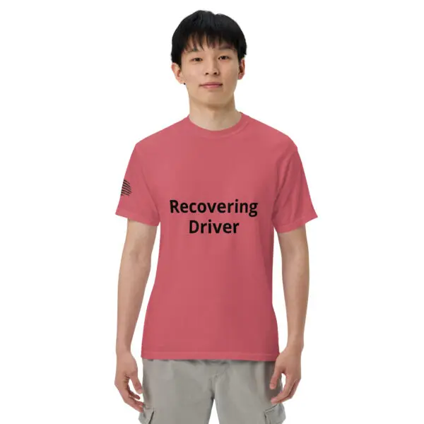 Man wearing a pink "Recovering Driver" t-shirt.