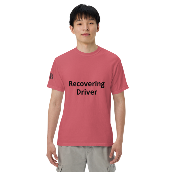 Man wearing a pink "Recovering Driver" shirt.