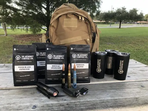 Blackout Coffee Co. gear on a wooden table.