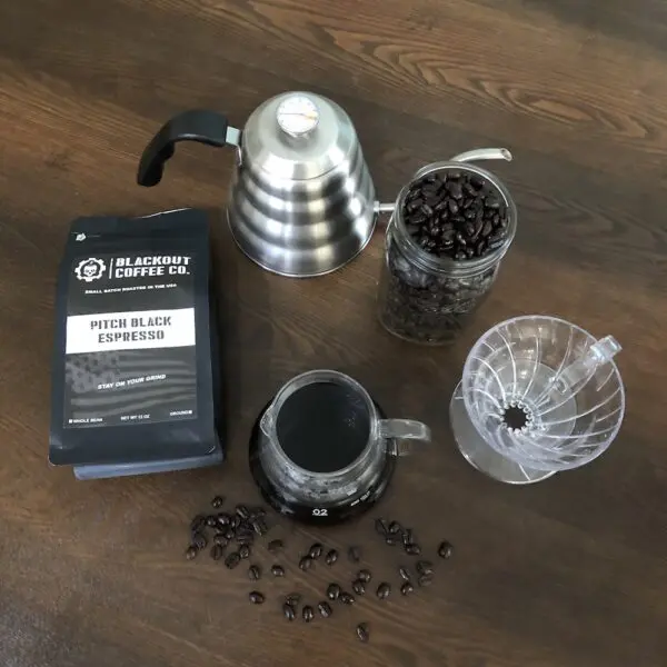 Espresso brewing setup with coffee beans.