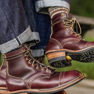 Two pairs of brown leather boots.