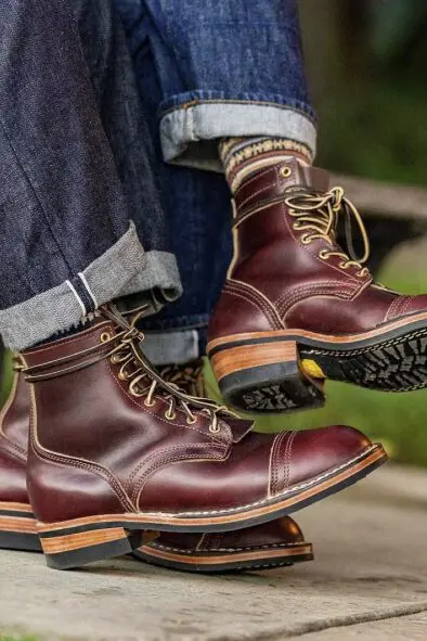 Two pairs of brown leather boots.