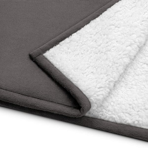 Gray and white soft fleece blanket.