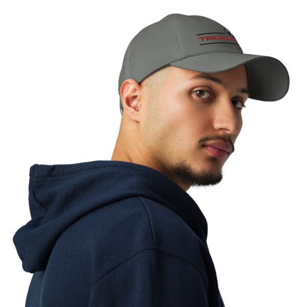 Man wearing a grey trucker hat.