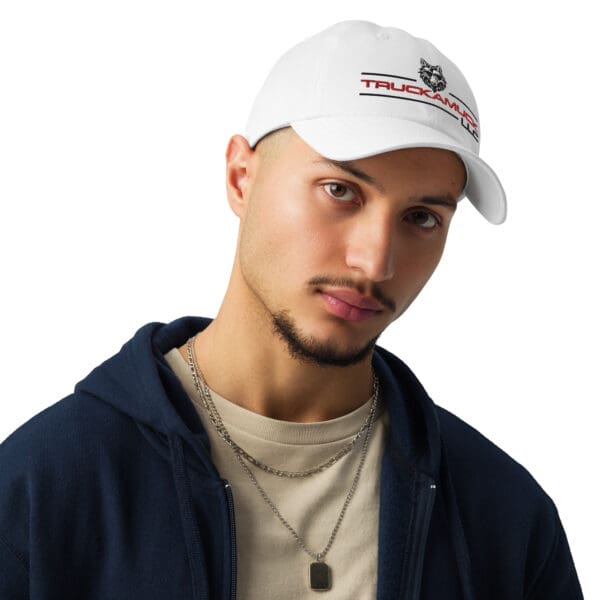 Man wearing a white Trucker Life hat.