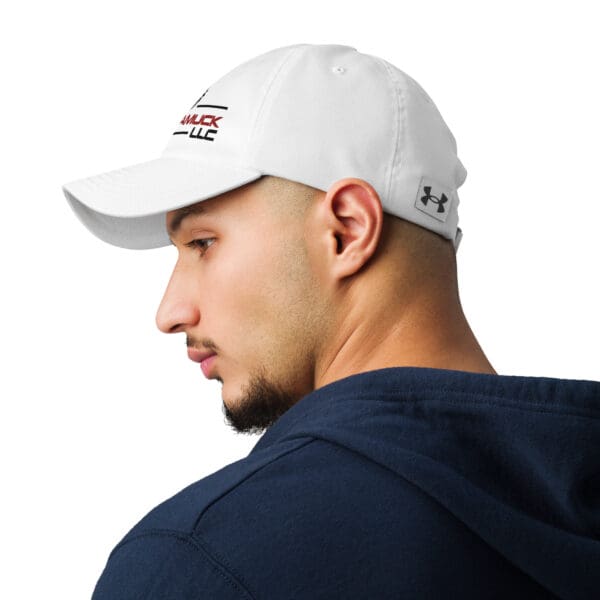 Man wearing a white baseball cap.